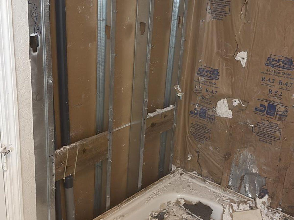 Shower wall opened to the studs with tile removed