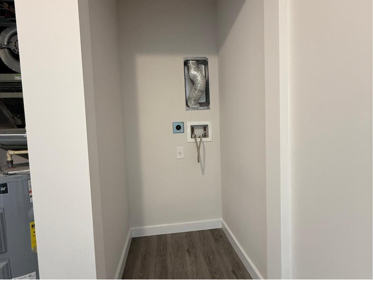Laundry closet finished with new drywall, flooring and baseboards